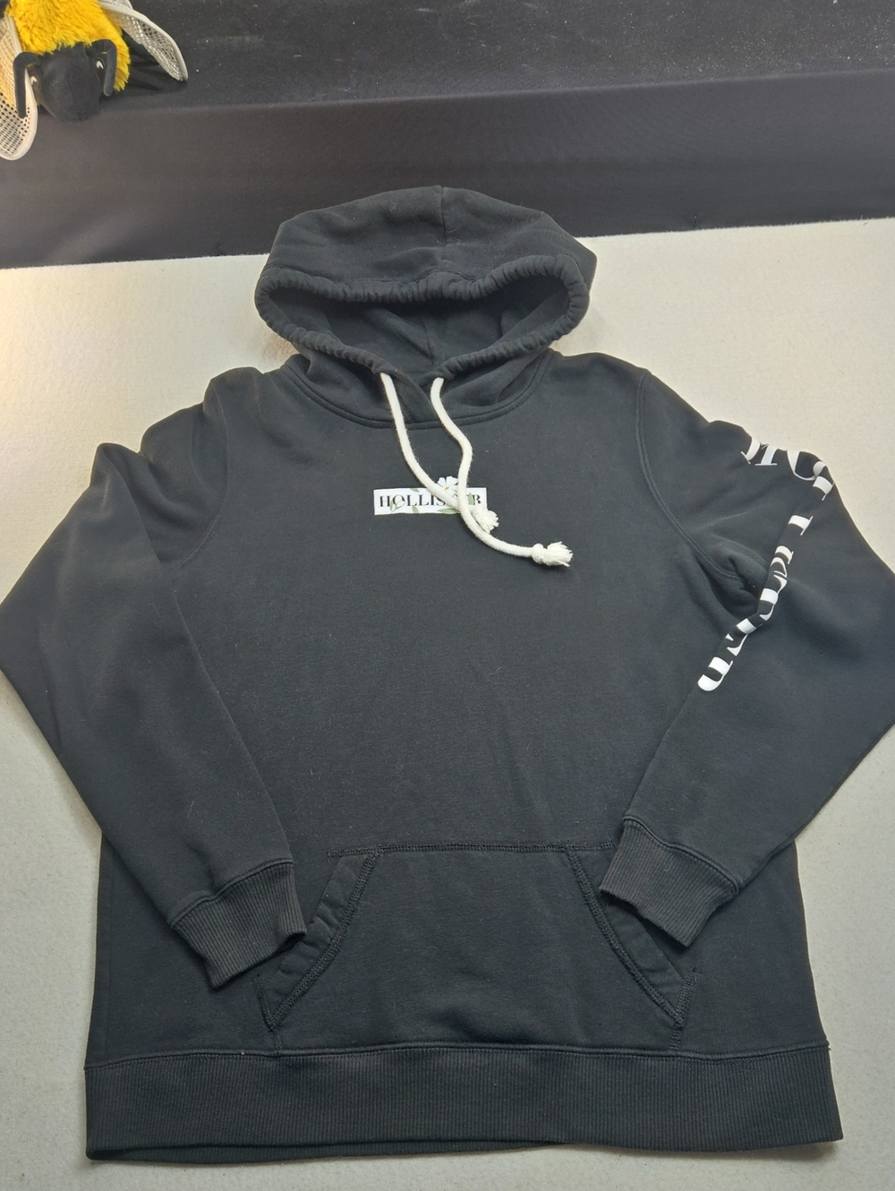 Hollister Black Pullover Hoodie with White Logo and Drawcord